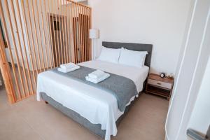 A bed or beds in a room at Villa Athina