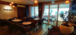 A restaurant or other place to eat at THEMIS BEACH