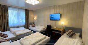 Postel nebo postele na pokoji v ubytování Hotel Austria