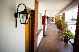 a hallway of a building with a light fixture at Hotel Salvador in Bailén
