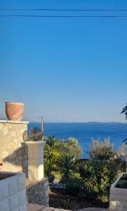 a view of the ocean from a house at Stefanosplace ApartHotel Sea View in Barbati