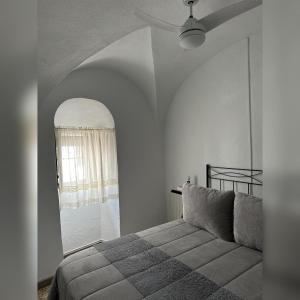 Łóżko lub łóżka w pokoju w obiekcie Casa Villanueva de Córdoba