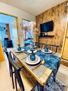 a dining room table with a vase on it at Minimalist Condo One Spatial Iloilo 2 Bedroom Unit in Iloilo City