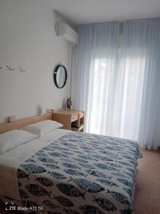 Postel nebo postele na pokoji v ubytování Ninfea rooms