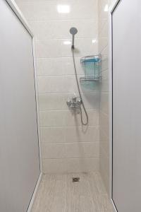 a bathroom with a shower with a glass door at 1001-NOCH in Tashkent