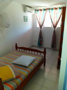 Una cama o camas en una habitación de Appartement confortable à Le Marin, jardin, 80 m², proche mer