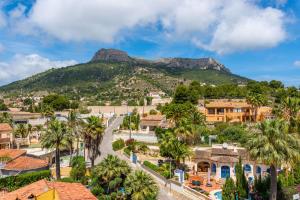 a view of a town with a mountain in the background at Apartment Happy - PlusHolidays in Calpe
