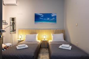 Postel nebo postele na pokoji v ubytování Rithian Blue Coast 2 bedroom seaview apartment