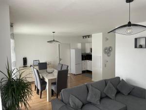 a living room with a couch and a table at appartement vacances en copropriété avec parking in Saint Malo