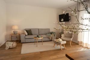 a living room with a couch and a table at Haus 2 in Klenzau