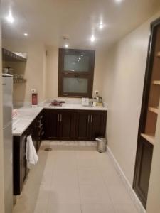 a kitchen with a sink and a window at Peaceful Private Villa at Five Star Beach Resort in Ras al Khaimah