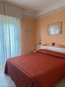 Postel nebo postele na pokoji v ubytování Hotel Ambra