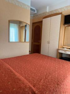Postel nebo postele na pokoji v ubytování Hotel Ambra