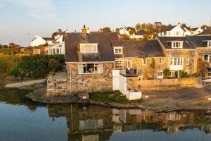an aerial view of a house on the water at Compass Cottage in Abersoch