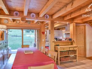 a kitchen with a long table in a room at Chalet Le Grand-Bornand, 8 pièces, 11 personnes - FR-1-391-22 in Le Grand-Bornand