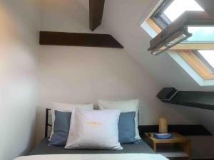 Ένα ή περισσότερα κρεβάτια σε δωμάτιο στο Cozy Appartment near Paris - Donizetti