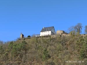 a house sitting on top of a hill at Ferienhaus Laila in Hochstetten-Dhaun