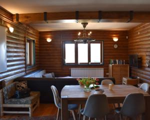 a living room with a table and a couch at Haus Dragan in Grahovo