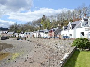 a row of houses in a small town at Bayview Cottage in Plockton