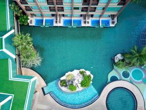 an overhead view of a swimming pool with a garden at Novotel Phuket Vintage Park Resort in Patong Beach