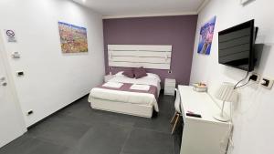 Postel nebo postele na pokoji v ubytování Soave Rooms