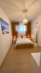 Postel nebo postele na pokoji v ubytování EllinFos Apartments + 37 fotografií