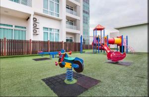 a playground in a yard in front of a building at KSL Mall - High Speed WiFi - Bathtub - Netflix - 24-7 Support in Johor Bahru