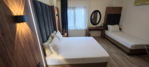 Postel nebo postele na pokoji v ubytování Star Hotel