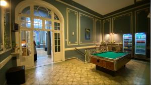 a room with a pool table in a room at Hostel Alvear in Córdoba +39 photos