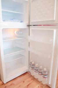 a refrigerator with bottles of water inside of it at BATH B / Vacation STAY 54888 in Beppu