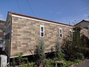 una casa se muestra con un edificio en BATH B / Vacation STAY 54888, en Beppu