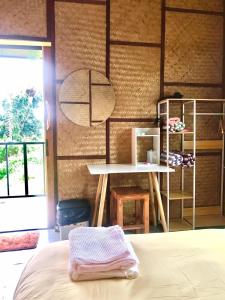 Postel nebo postele na pokoji v ubytování Chompunud House589 ชมพูนุชเฮ้าส์589