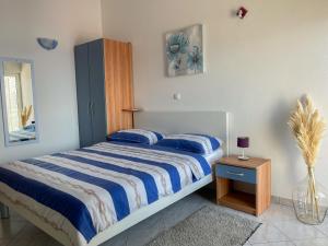 Łóżko lub łóżka w pokoju w obiekcie Apartments Marija Magdalena