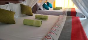 Katil atau katil-katil dalam bilik di Pearl View Guesthouse