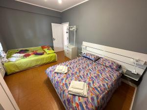a small bedroom with a bed and a mirror at Casa Natalina in Monterosso al Mare