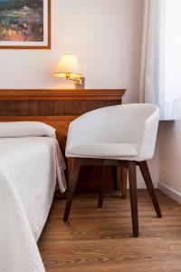 A bed or beds in a room at Hotel Araxa - Adults Only