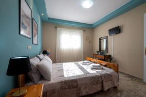 Postel nebo postele na pokoji v ubytování Pavlina’s Apartments