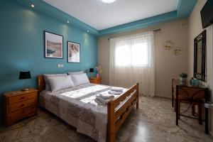 Postel nebo postele na pokoji v ubytování Pavlina’s Apartments