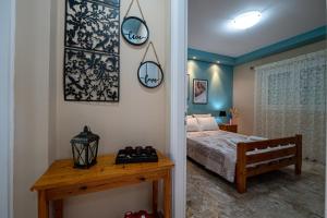 Postel nebo postele na pokoji v ubytování Pavlina’s Apartments