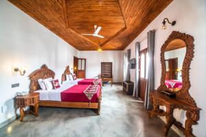 Кровать или кровати в номере Tembo House Hotel