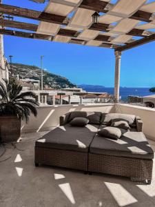 a bed sitting on top of a patio at boutique Villa Dorma in Dubrovnik