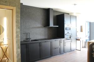 Kuchyň nebo kuchyňský kout v ubytování Casas da Fortaleza