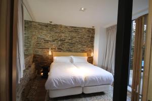 Postel nebo postele na pokoji v ubytování Casas da Fortaleza