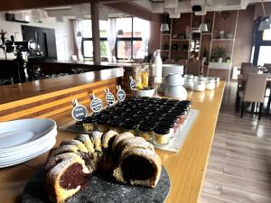 a table with a loaf of bread on a table at Hotel Žabčice in Žabčice