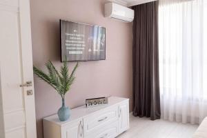 TV i/ili multimedijalni sistem u objektu RentWill apartments Clouds