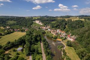 an aerial view of a town next to a river at UniqHotel Česky Šternberk in Český Šternberk