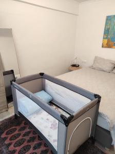 a bedroom with a bed with a drawer at NEW stylish comfortable basement loft-like apartment in Athens