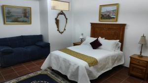 Voodi või voodid majutusasutuse Hotel Boutique Casona Mashei toas