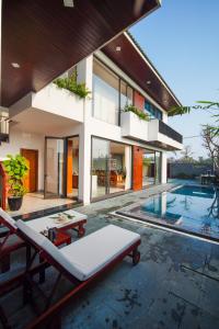 an image of a house with a swimming pool at Hola Villa 1 by Ovui in Hoi An