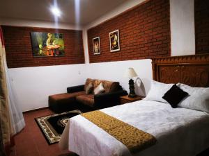 Voodi või voodid majutusasutuse Hotel Boutique Casona Mashei toas